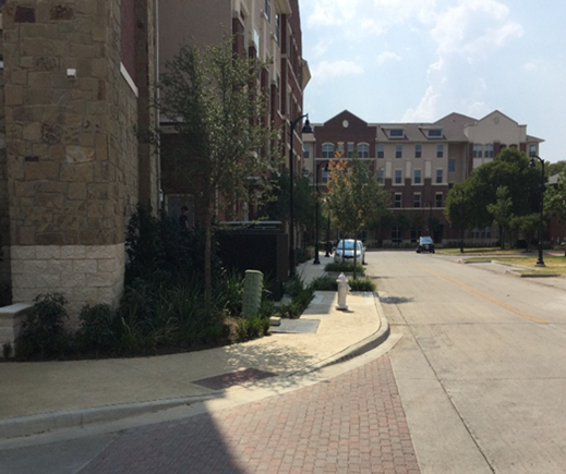 This is an image of sidewalks near buildings in Farmers Branch, Texas
