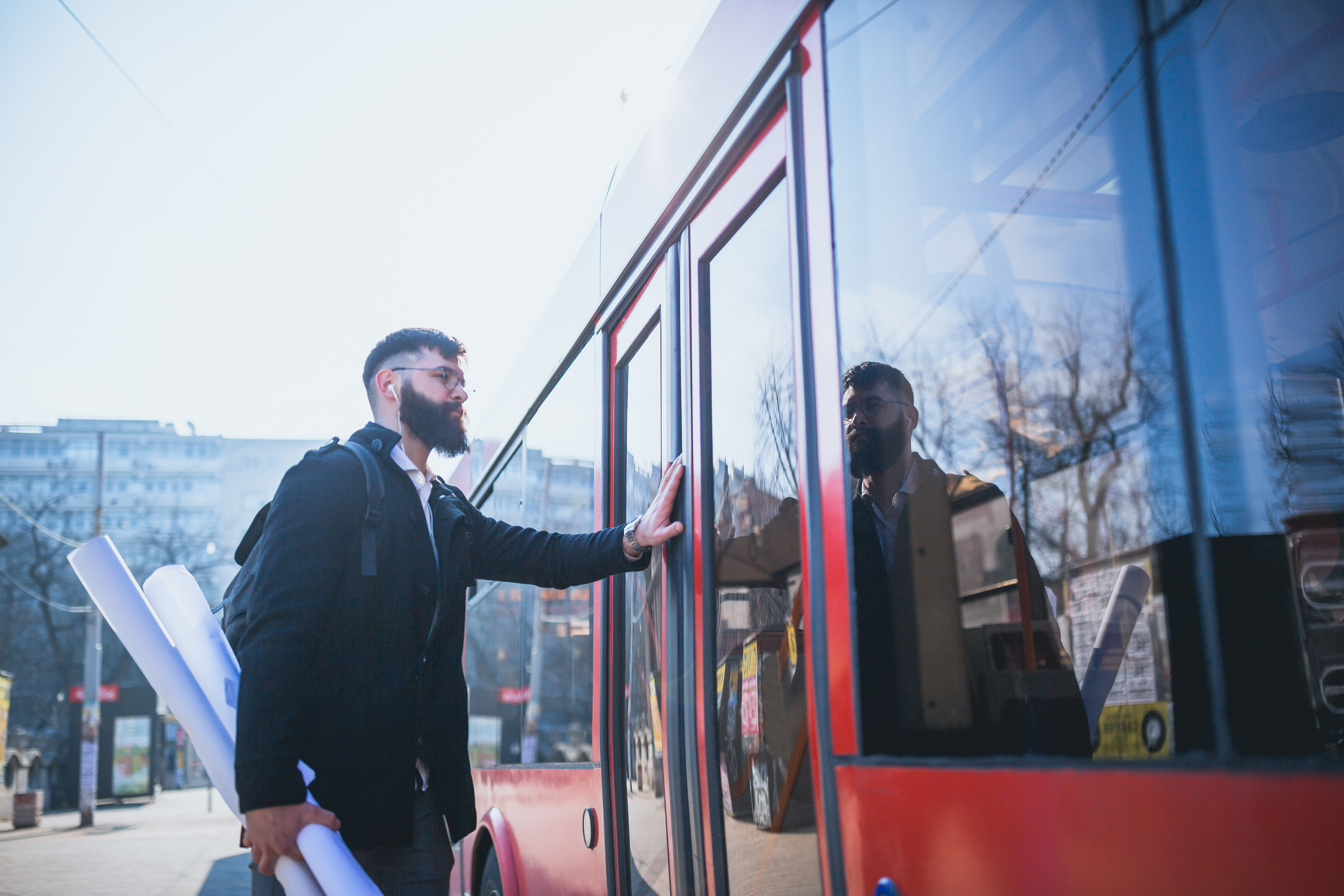 This is an image of a man boarding a train