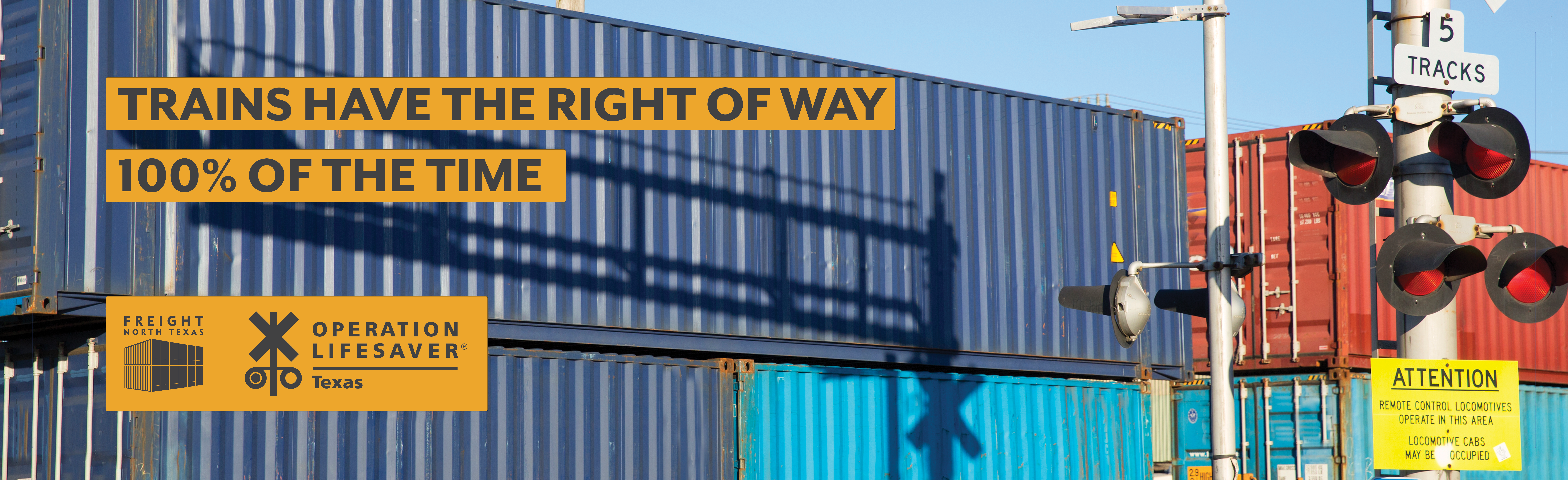 Railroad crossing with training moving by and phrase Trains have the right of way 100%25 of the time