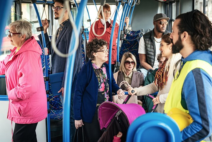 Several people riding a bus
