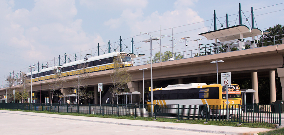 DART Light Rail Train with a DART Bus Below