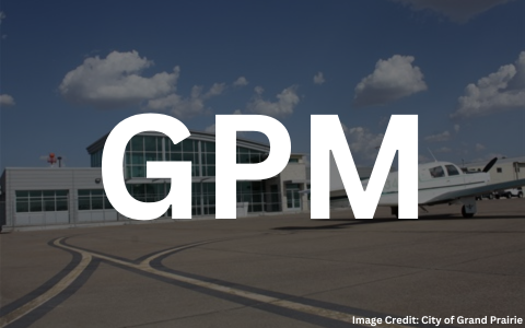 A piston engine aircraft parked on the ramp at Grand Prairie Airport